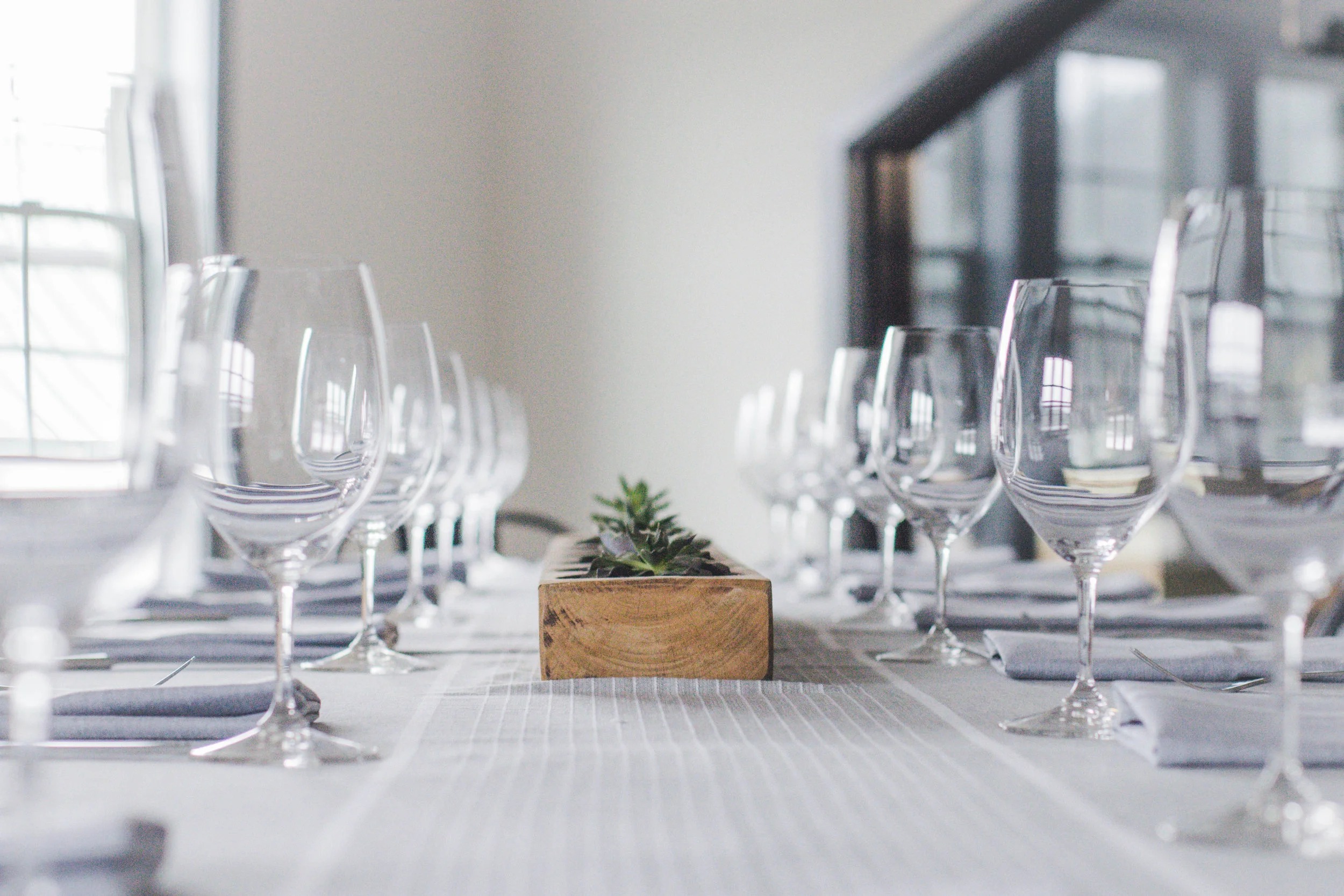 A candlelit table set for dinner at Brix 25° above the Gig Harbor waterfront